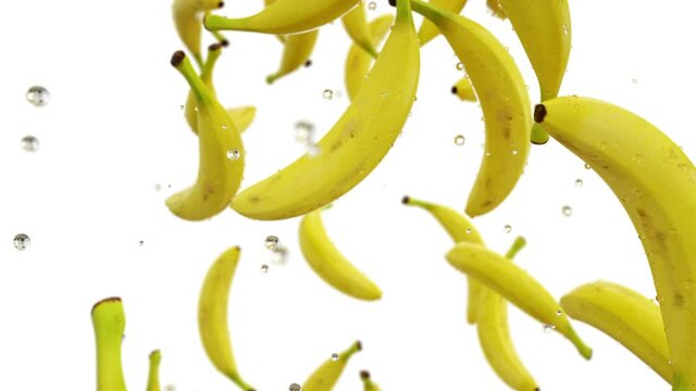 Fresh bananas falling with water drops. Slow motion. Realistic animation. Isolate with alpha channel