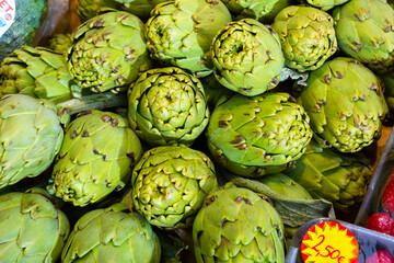 Fototapeta premium Artichokes on showcase of greengrocery