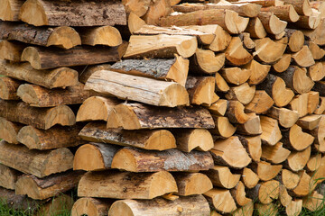 Firewood on the street stacked beautifully in the yard.