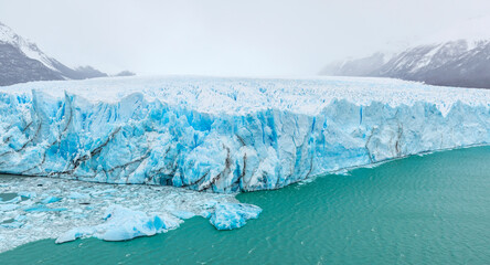 Perito Moreno glacier panorama in mist and fog of the winter in Patagonia, Los Glaciares national park, Argentina.