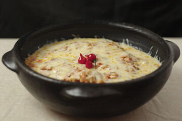 Moqueca - fish with sauce covered with cheese