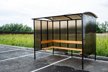 bus stop in a rural village, made of brown polycarbonate, outdoors
