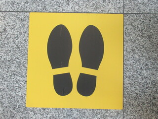 Shoes sign for social distancing for corona virus