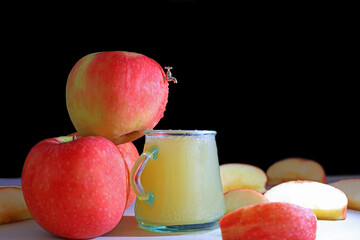 A scale model tap in the side of an apple used to extract fresh apple juice.