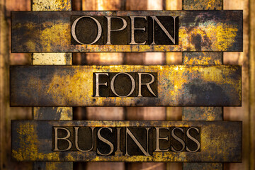 Open for Business text formed with real authentic typeset letters on vintage textured silver grunge...