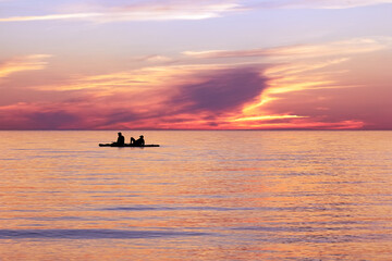 Fototapeta premium silhouette of a man in a boat