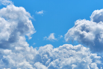 Naklejka na ściany i meble Thick white clouds with copy space and blue sky.