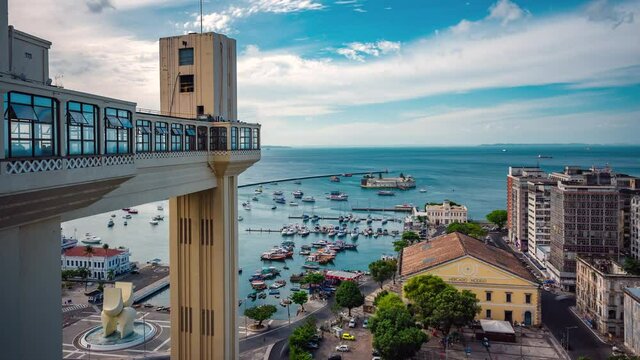 Salvador, Bahia, Brazil, daytime time lapse view of historical landmarks Lacerda Lift and Modelo Market during summer.