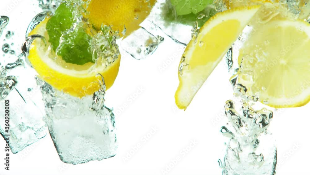 Poster super slow motion of lemon slices falling into water with ice cubes on white. filmed on high speed c