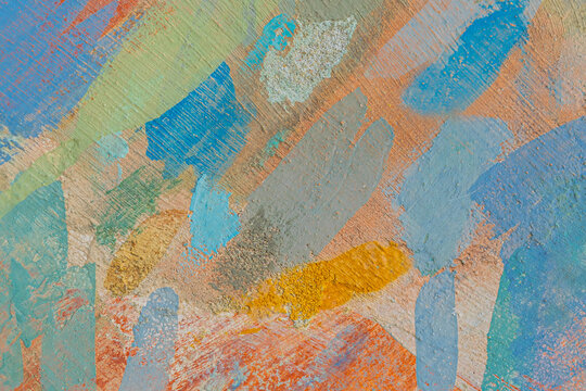 Front view of rough street wall, painted with random brushstrokes in different colors. Tbilisi, Georgia