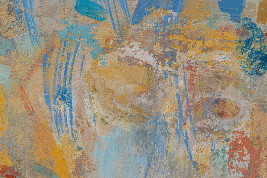 Front view of rough street wall, painted with random brushstrokes in different colors. Tbilisi, Georgia