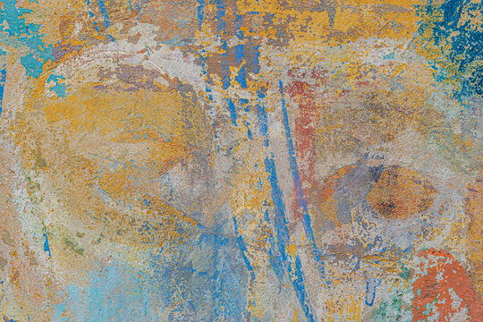 Front view of rough street wall, painted with random brushstrokes in different colors. Tbilisi, Georgia