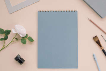 Office desk with inspiring objects and stationery for creating or drawing. Copy space, flat lay, top view.