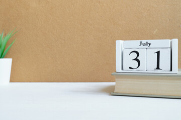 31th july - thirty-first month calendar concept on wooden blocks with copy space.