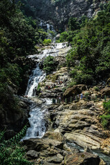 Ravana waterfall Sri Lanka. Crowded touristic spot called Ravana falls on a beautiful sunny day. Natural landmark in central Sri Lanka.