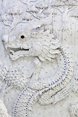 Bas-relief with Dragon - detail of Wat Huay Pla Kang, known as Big Buddha temple in Chiang Rai, Northern Thailand