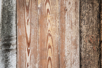 Colorful mix of old, painted wooden wainscotting with rough texture and a grungy vintage look