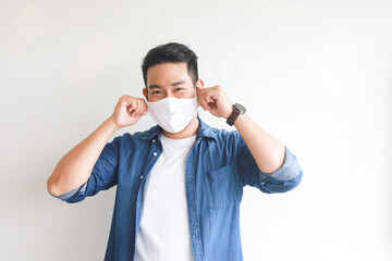 Asian man with face mask on white 