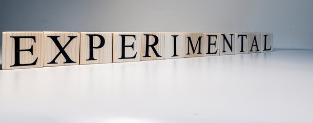 Experimental text from wooden cubes. Close up.