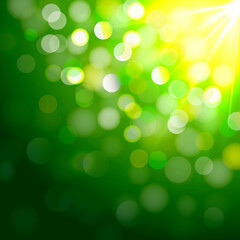 Fototapeta premium Abstract glowing green background with bokeh light and sun beams