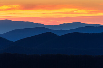 Fototapeta na wymiar Bright blue color dominates the Blue Ridge mountains at sunset