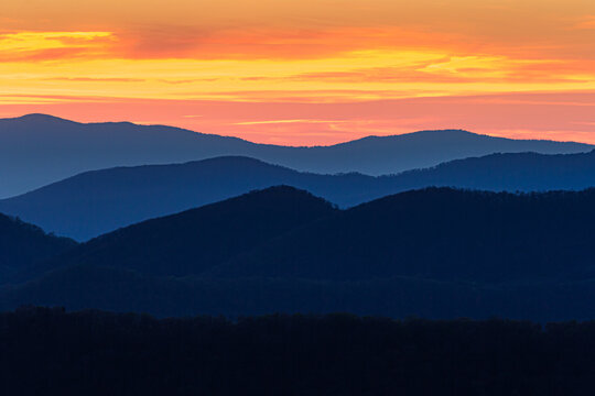 Bright blue color dominates the Blue Ridge mountains at sunset
