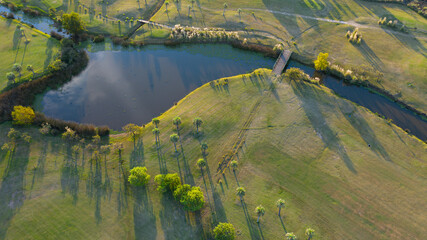 Drone view of a field with colorful trees and a beautiful surrounding nature