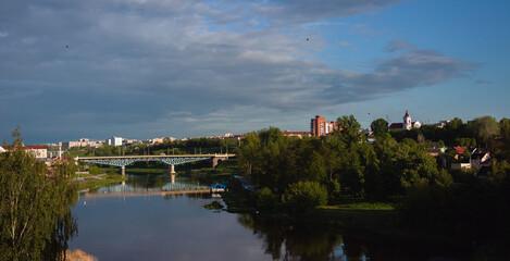 Fototapeta na wymiar Sights and views of Grodno. Belarus. View of the Neman river, bridge, Catholic church, town houses.