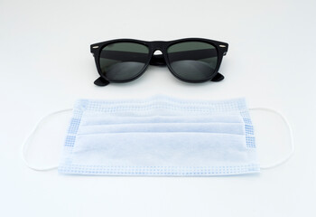 sunglasses and protective face mask