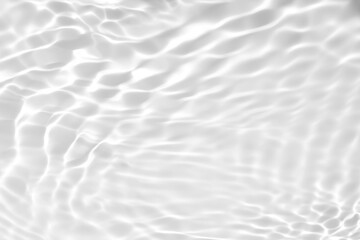 Closeup of desaturated transparent clear calm water surface texture with splashes and bubbles. Trendy abstract nature background