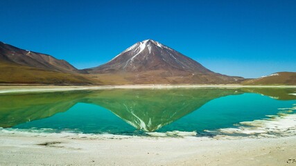Laguna Verde and Licancabur Volcano, Bolivia. Green colored lake and volcano in the background in the Bolivian desert © Jair