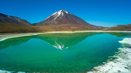 Laguna Verde and Licancabur Volcano, Bolivia. Green colored lake and volcano in the background in the Bolivian desert © Jair