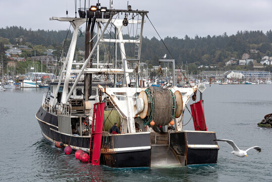 Fishing vessel returning to port in Newport Oregon.