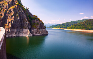 A beautiful landscape with the Vidra lake. The calm water of the storage lake Vidra.
