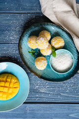 Mango Coconut Ladoo – sweet balls made of mango puree, desiccated coconut and condensed milk
