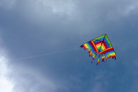 Kite in the sky with storm clouds