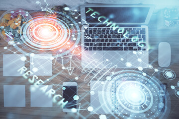 Double exposure of data theme drawing hologram over topview work table background with computer. Concept of technology.