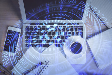 Multi exposure of data theme drawing hologram over topview work desk background with computer. Concept of technology.