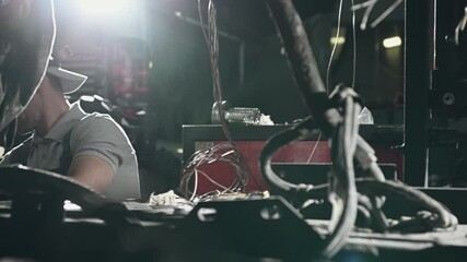 Mechanic Repairing And Replacing Malfunctioning Engine Of Bus In Automotive Garage. 