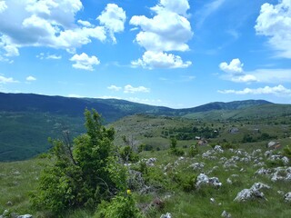 Fototapeta na wymiar Landscape with mountains and blue sky