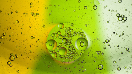 Oil and water mixed together abstract green colorful bubble macro photography wallpaper