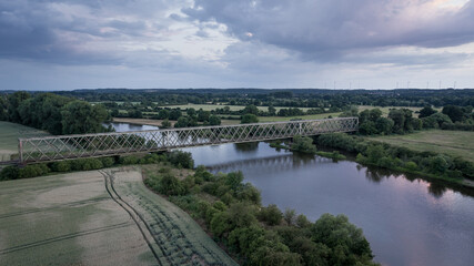 Fototapeta na wymiar abandoned railway bridge over the river