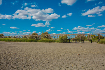Bridge. Wooden bridge on the lagoon “Fuente De Piedra”. 
