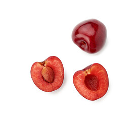 whole ripe red juicy sweet cherries and halves with pits