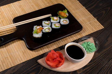 Sushi roll set with salad and fried shrimp