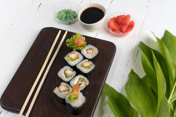 Sushi roll set with fried shrimp and salad