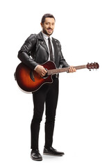 Man in a leather jacket standing and holding an electric guitar