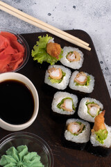 Sushi roll set with salad and fried shrimp