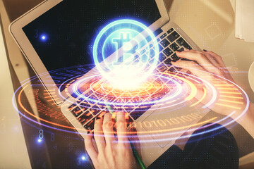 Double exposure of woman hands working on computer and blockchain theme hologram drawing. Top View....