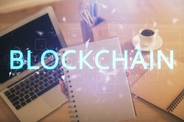 Double exposure of woman hands typing on computer and crypto market theme hologram drawing. Blockchain concept.